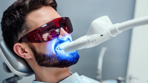 Getting teeth whitened at a Dentist